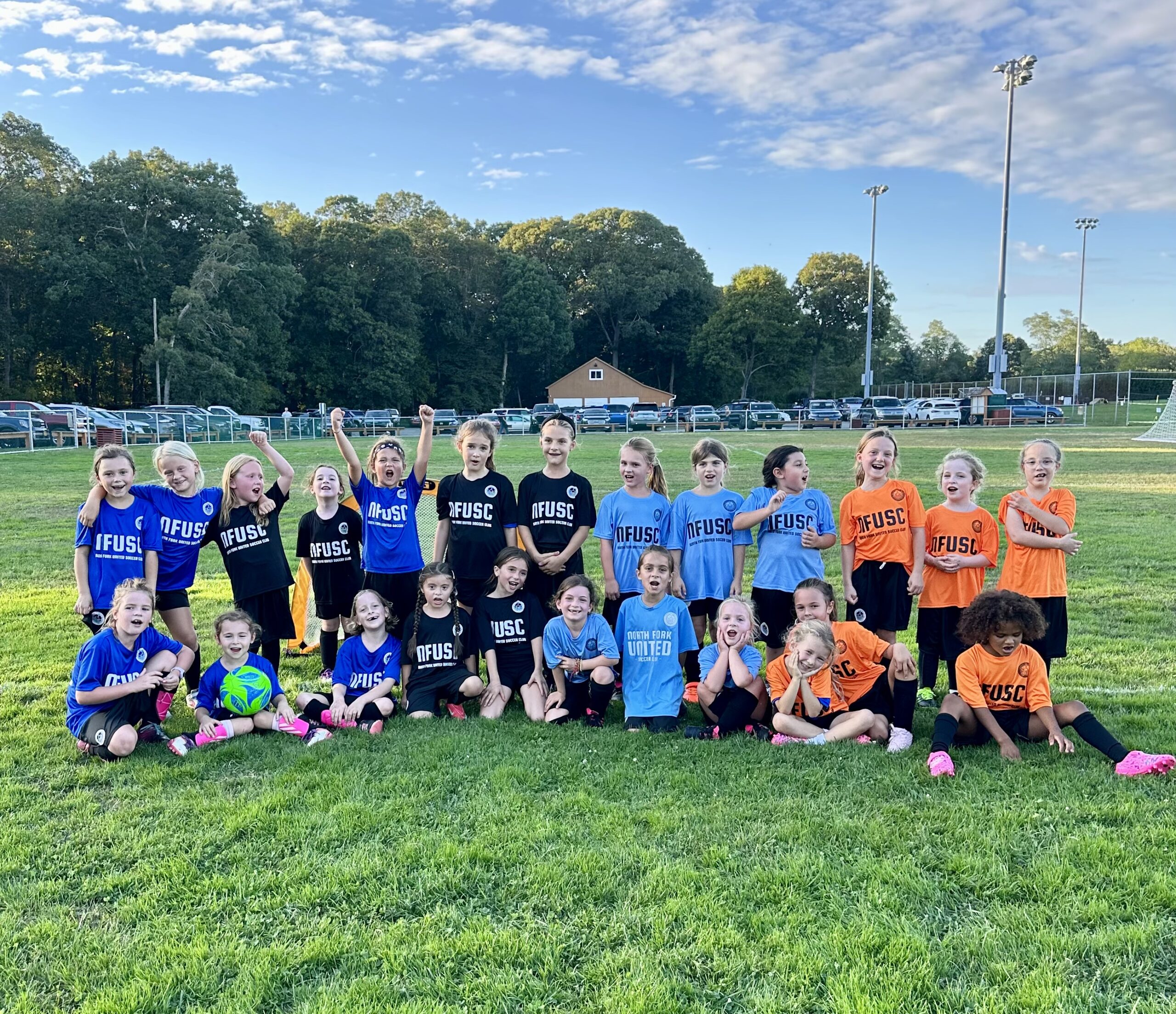 North Fork United players and coaches together as a team